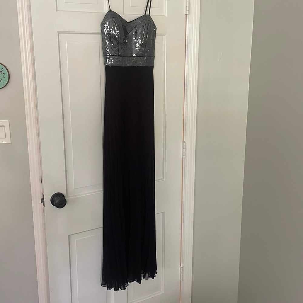 Strapless prom dress with pleated sheer skirt and mid thigh slip